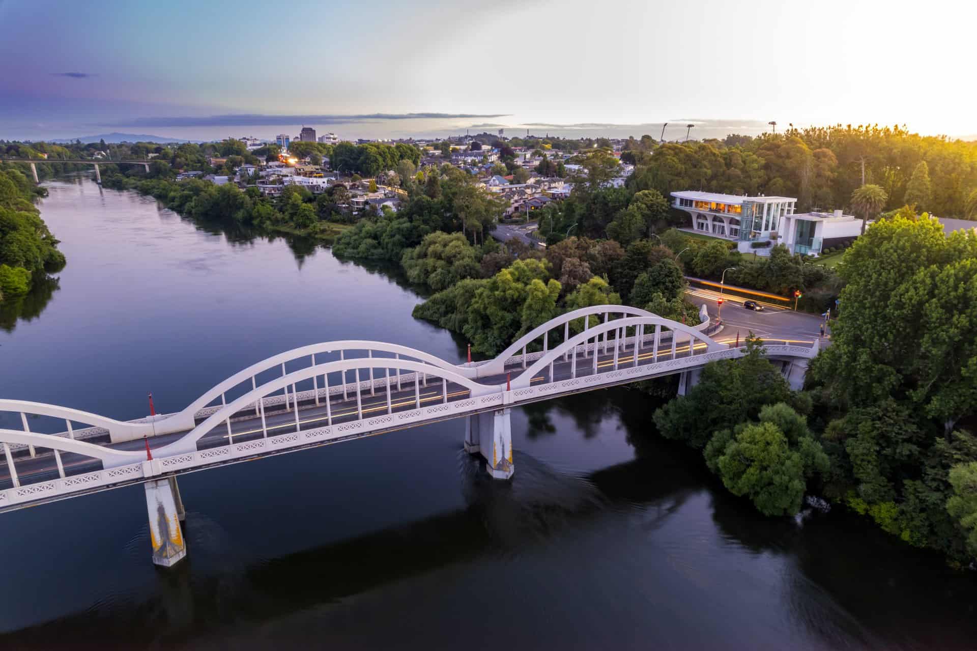 Aerial drone view at sunset, looking up the Waikato River towards the CBD, over the city of Hamilton (Kirikiriroa) in the Waikato region of New Zealand web-hosting